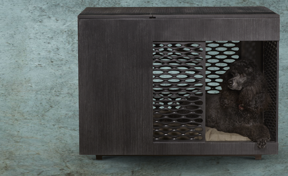 A black standard poodle gazes out from inside a modern refined credenza of hand-sanded, quartered Ebony.  The mid portion of the credenza has a screen pattern of modern ovals also in black.