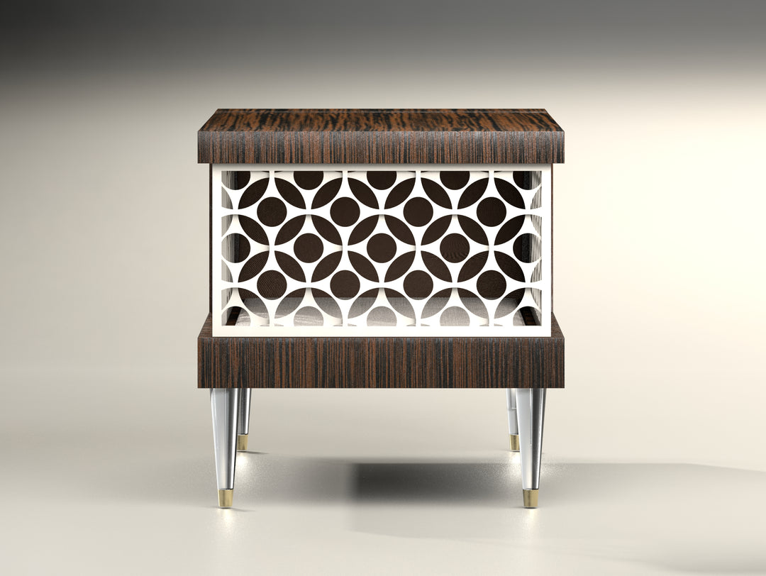 A 20" / 50.8cm high accent table of dark ebony with a crisp white mid-section of circled geometry, mid-century style. This center patern allows you to peer into the perfectly-finished piece that stands on 5"/12.7 cm clear lucite legs that are gold trimmed at the bottom.   